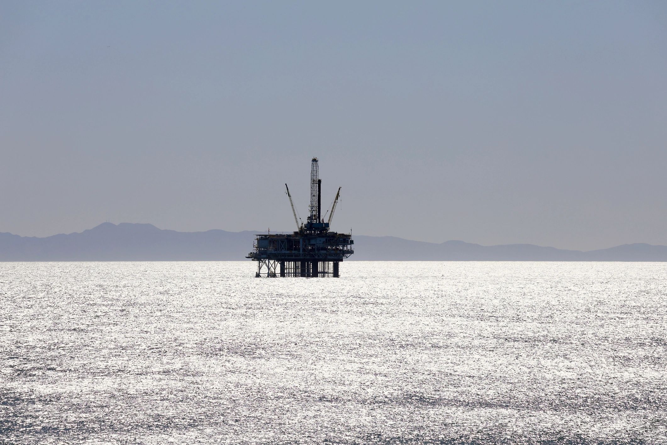 Offshore oil platform at sunset