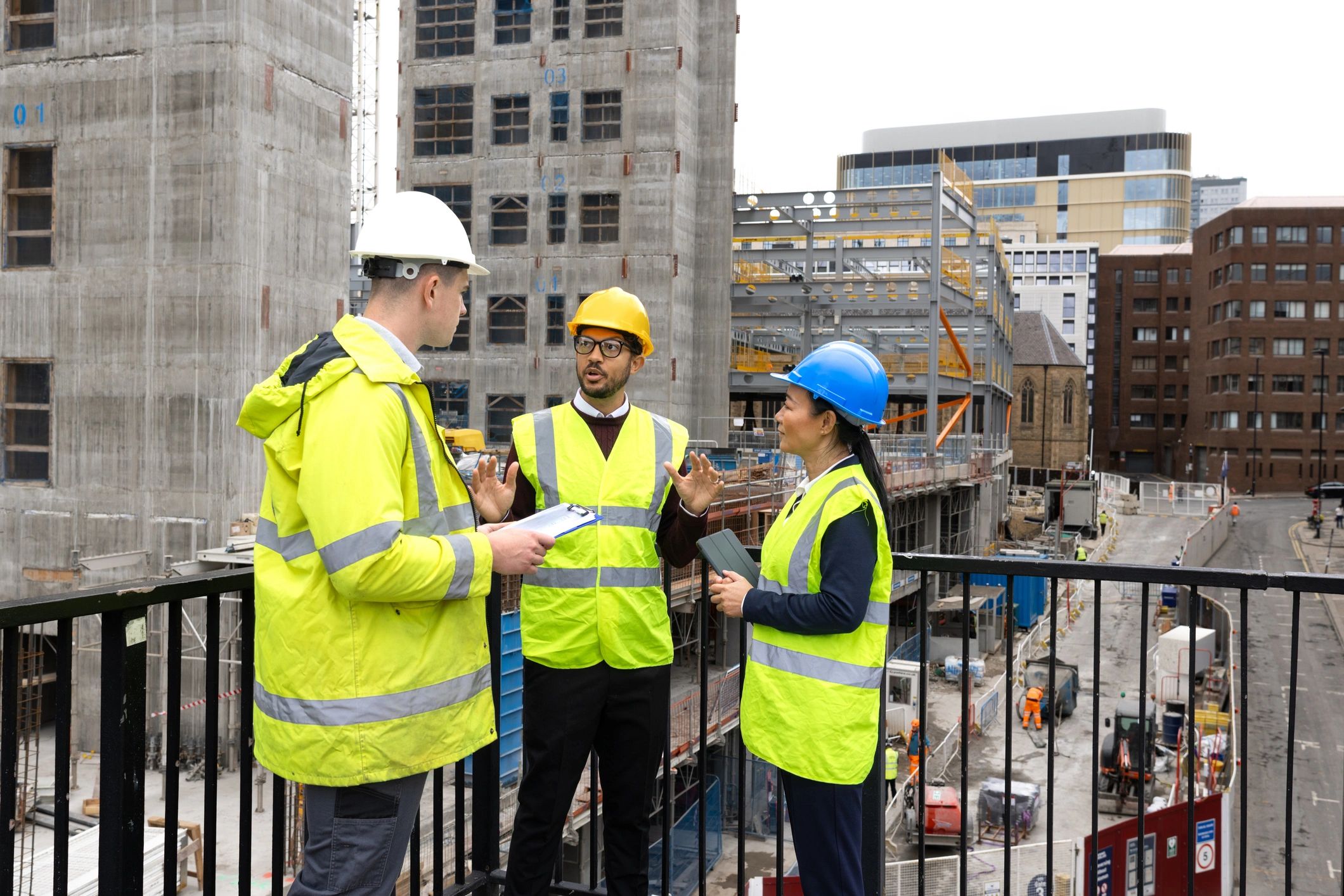 Energy professionals reviewing plans on an industrial site